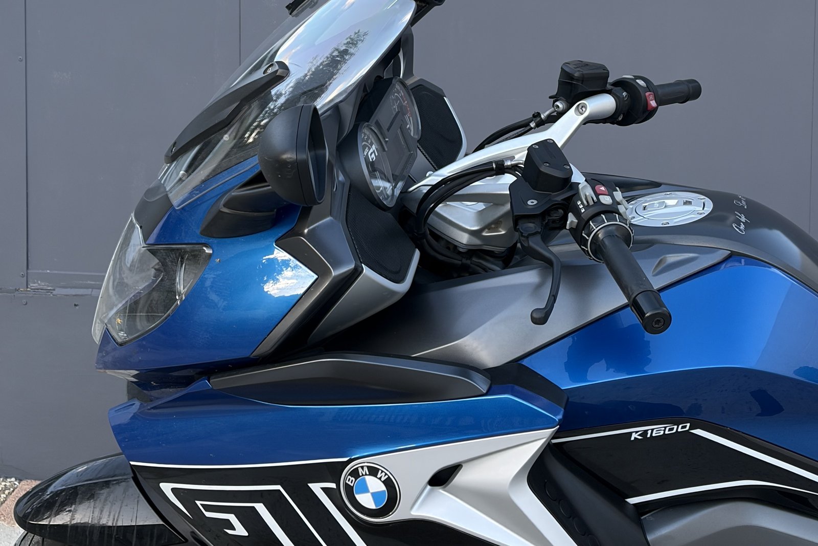 Close-up of the front fairing and GT lettering on a blue BMW K1600 GT.